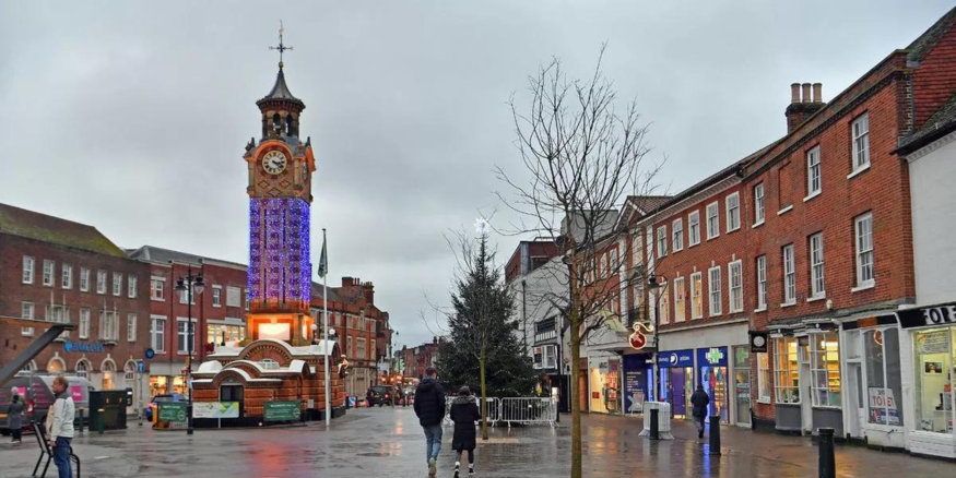 Photo of the town center in Woking, Surrey. You can see the JD and Peacocks stores in the background.